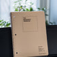 Musician's staff paper notebook, ruled edition, spiral bound, on keyboard stand